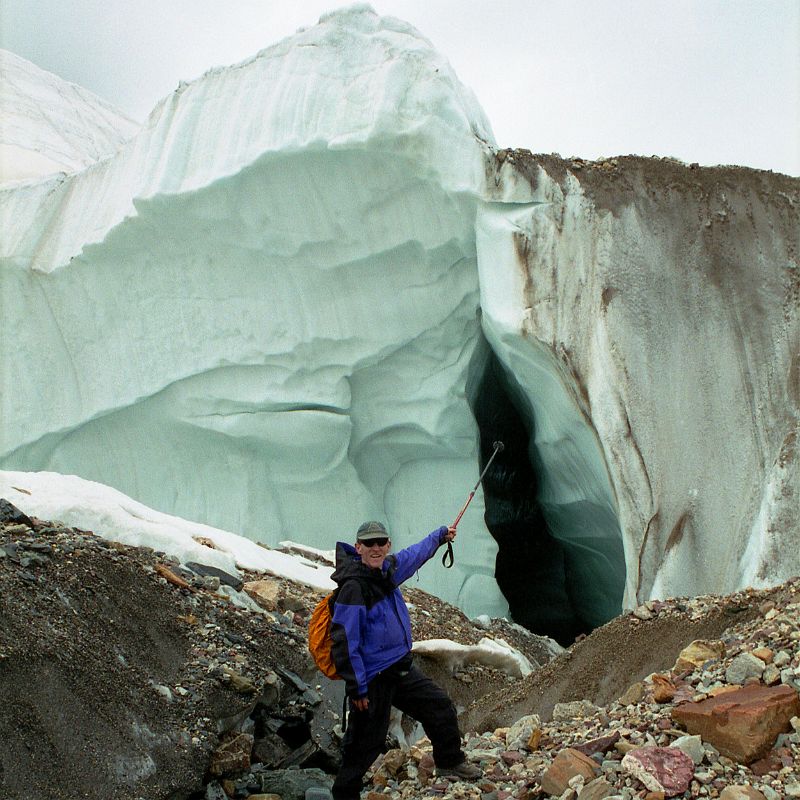 22 Jerome Ryan Points At True Glacier Below The Rubble On The Upper Baltoro Glacier We trekked back from Shagring camp to Concordia in cloudy weather, passing a side section of the Upper Baltoro Glacier that clearly shows that this isn�t just rubble trekking trail, but a real glacier with ice.